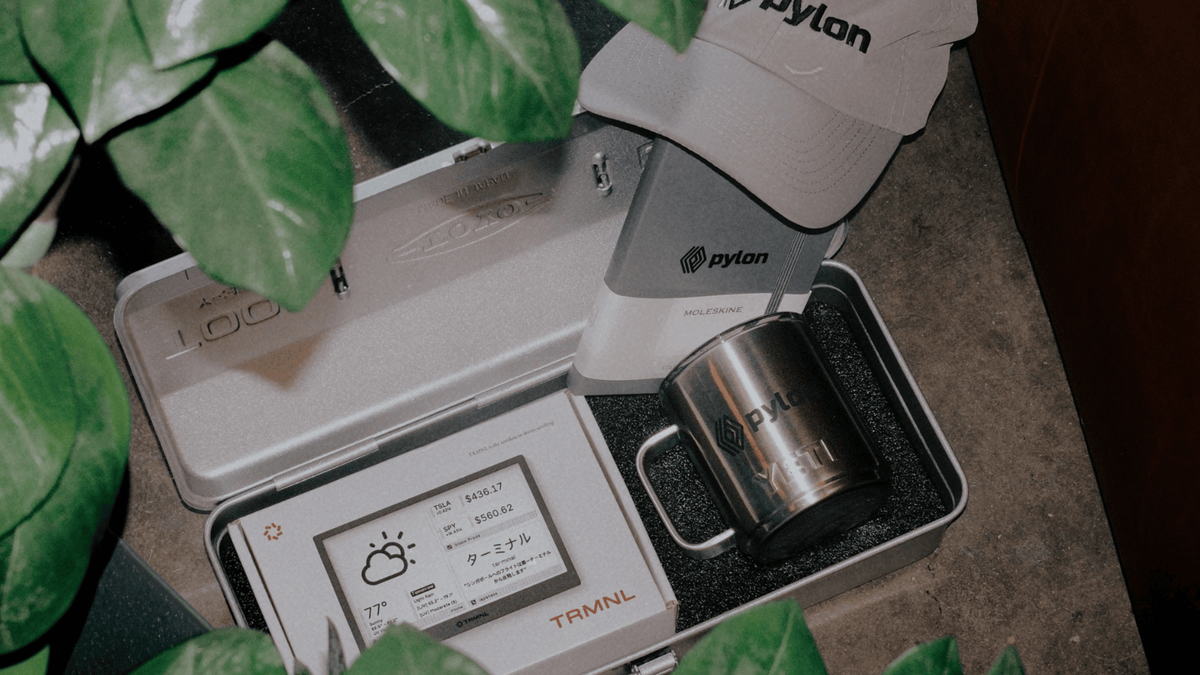 custom kit for Pylon, including a branded  hat, TRMNL e-ink device, YETI mug, inside a TOYO steel box