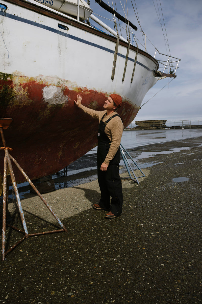 Lookbook feature of a ship and sailor on the Seattle coast