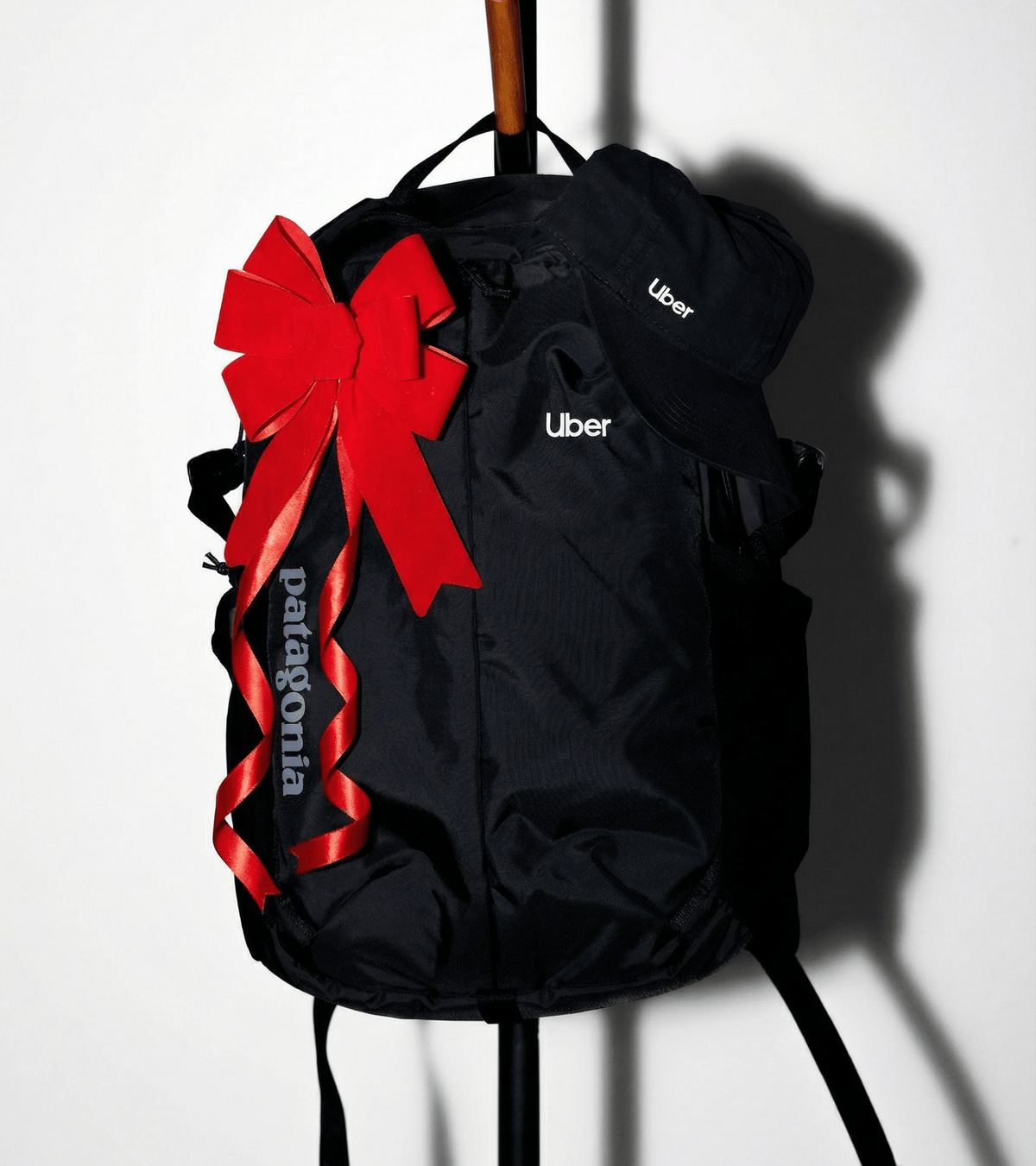 Custom branded Pategonia backpack and Nike hat exemplifying Uber's holiday gifting project